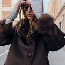 woman in faux fur lined Zara jacket