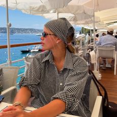 An image of @sofiarichiegrainge wearing one of the biggest summer accessories. 