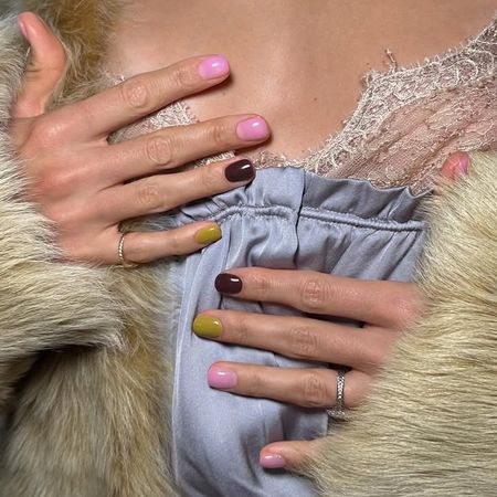 Photo of brown, green, and pink nails 