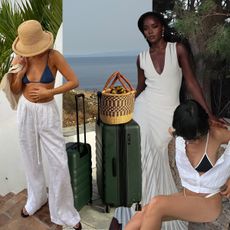 A woman in white linen trousers with a blue triangle top bikini and a bucket hat. Green luggage with a large woven tote on top. A woman sitting down wearing a black and white bikini. A woman in the background is wearing a white maxi dress. 