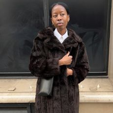 Woman in dark brown faux-fur coat